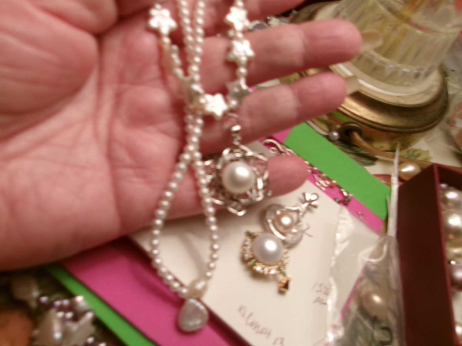 PEARL NECKLACE WITH STARS SLIPS OVER HEADSIZE 12 MM ON CENTER PEARL