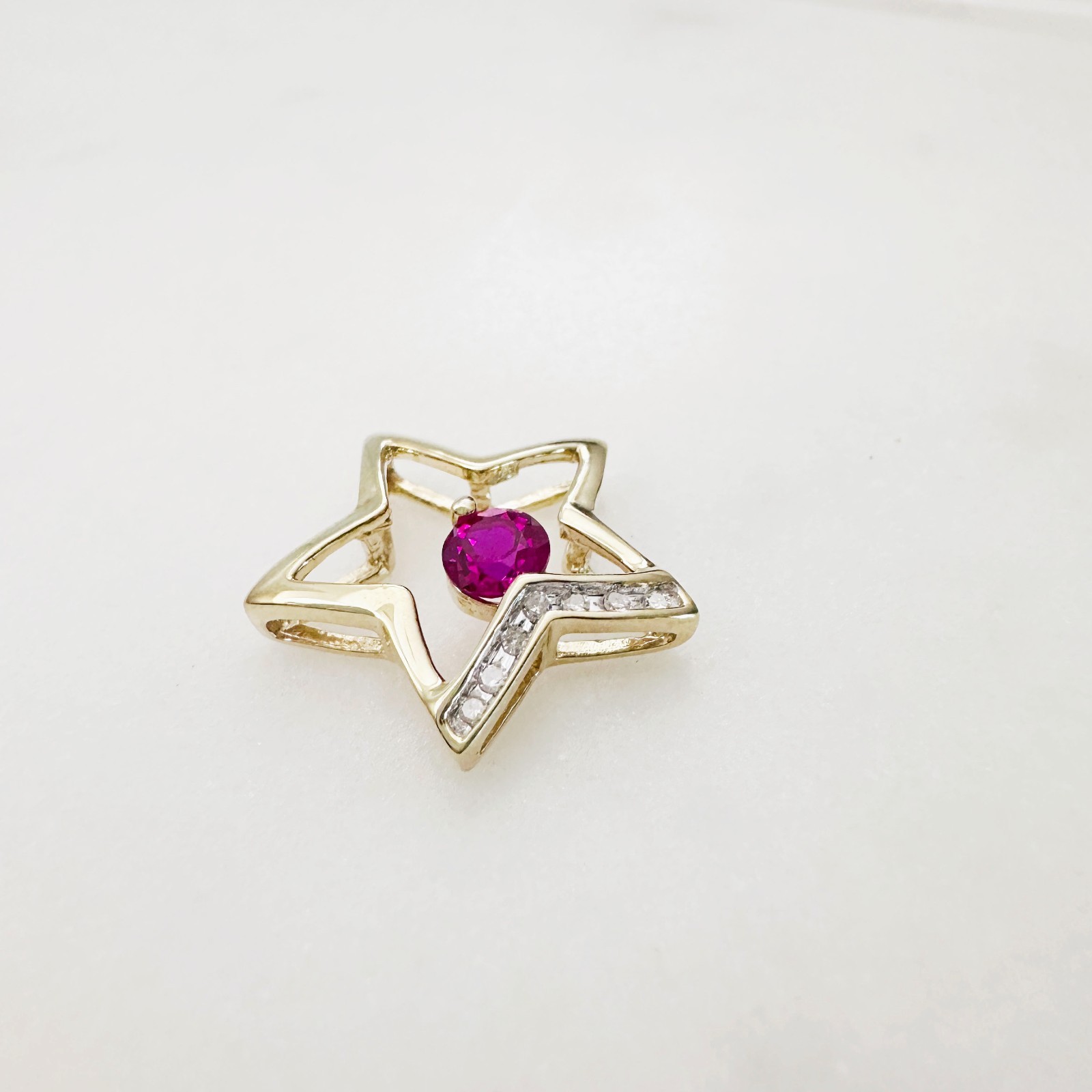 Solid 10K Yellow Gold .25ct Ruby & 7 Diamond Open Star Pendant 16mm, 1.2g