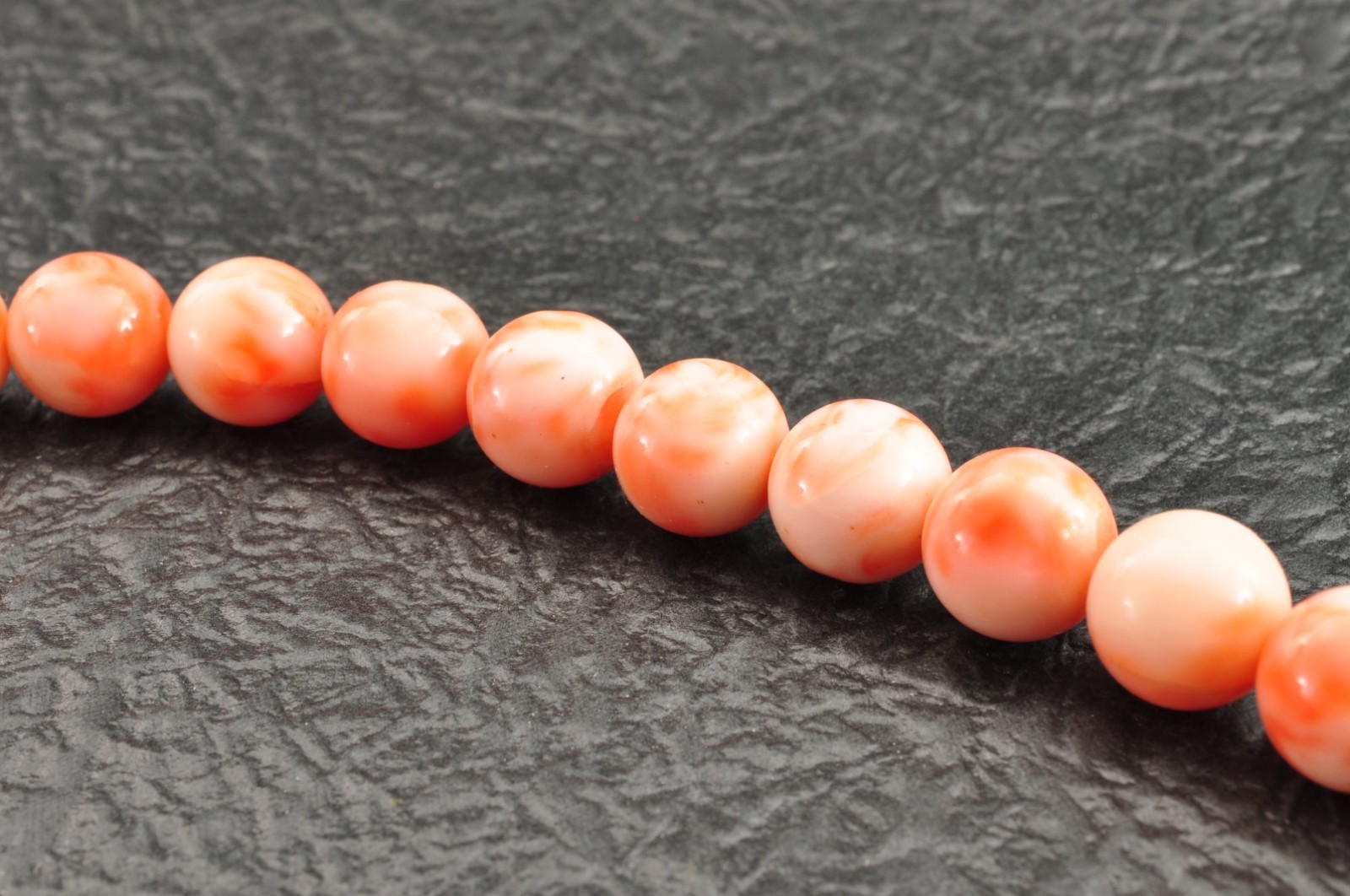 Angel skin coral necklace (17.3in, 423ct) ,925 silver clasp with “Certificate”.