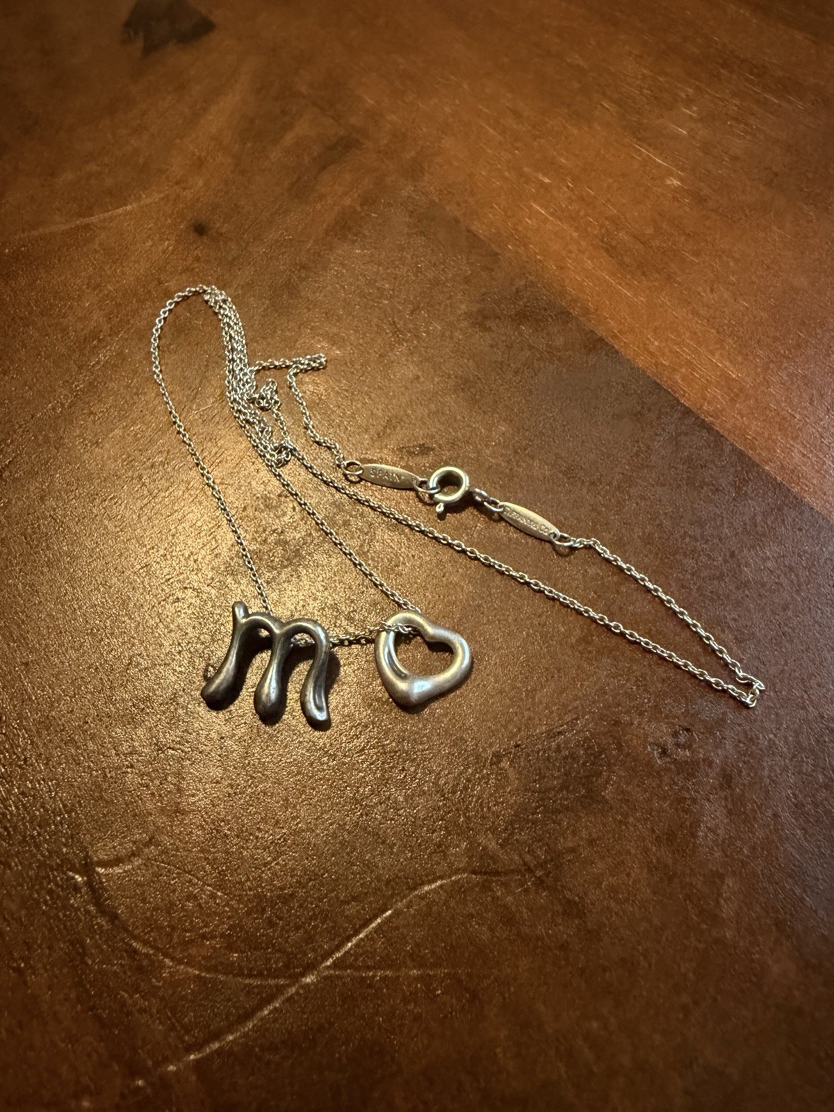Tiffany & Co. Elsa Peretti Alphabet Initial Letter “M” And Open Heart Pendant