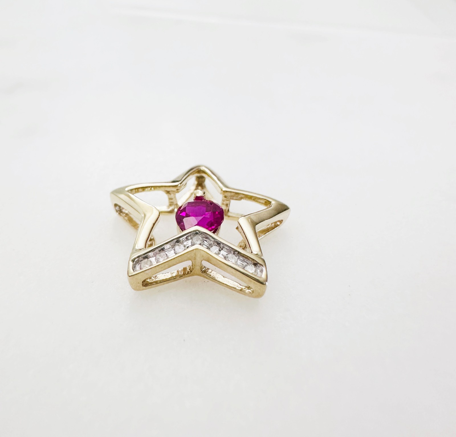 Solid 10K Yellow Gold .25ct Ruby & 7 Diamond Open Star Pendant 16mm, 1.2g