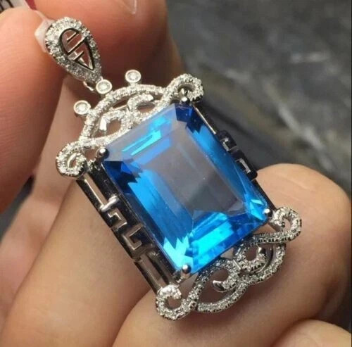 1.30 CT Solitaire Emerald Cut London Blue Topaz Pendant in 14K Gold Finish