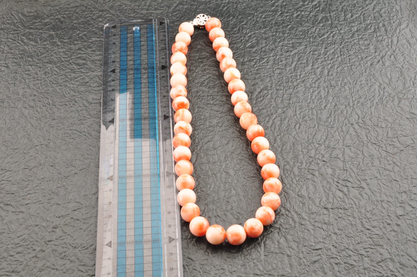 Angel skin coral necklace (17.3in, 423ct) ,925 silver clasp with “Certificate”.