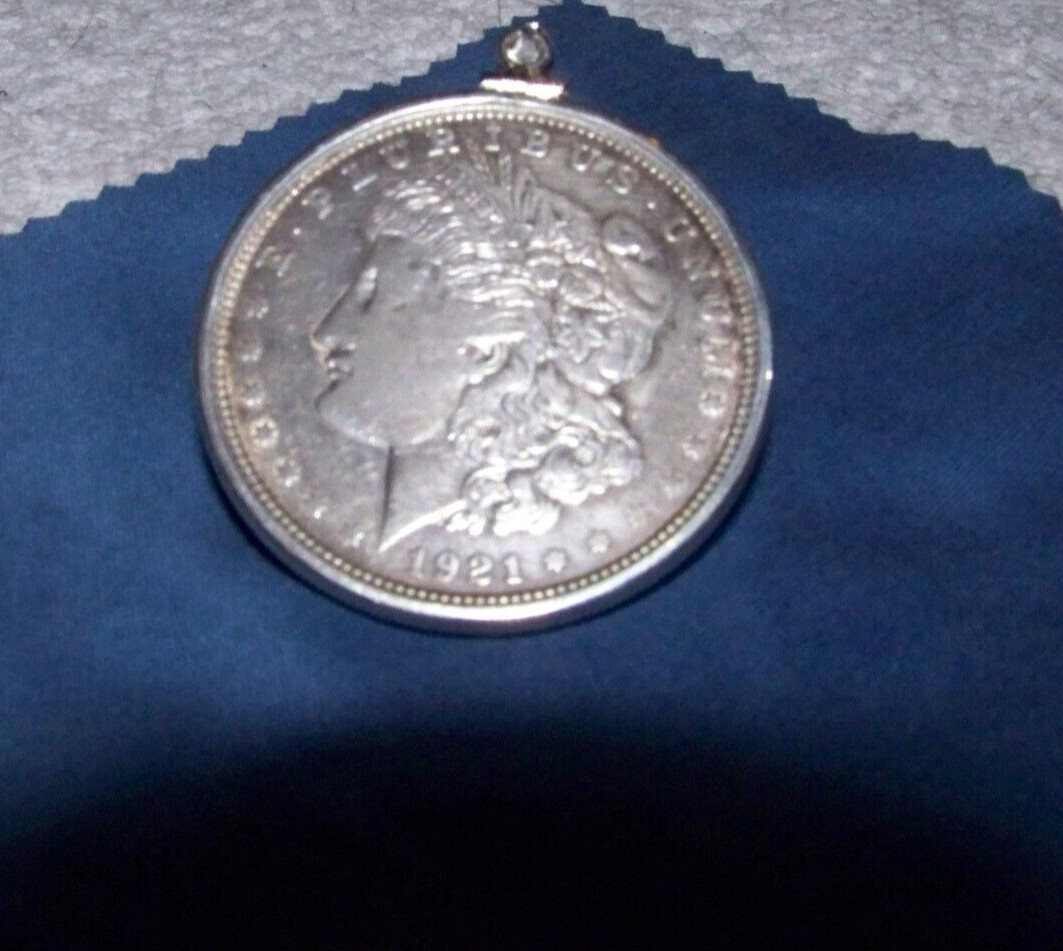 Morgan Silver Dollar in Sterling bezel on a 2mm 16–30-inch sterling necklace.