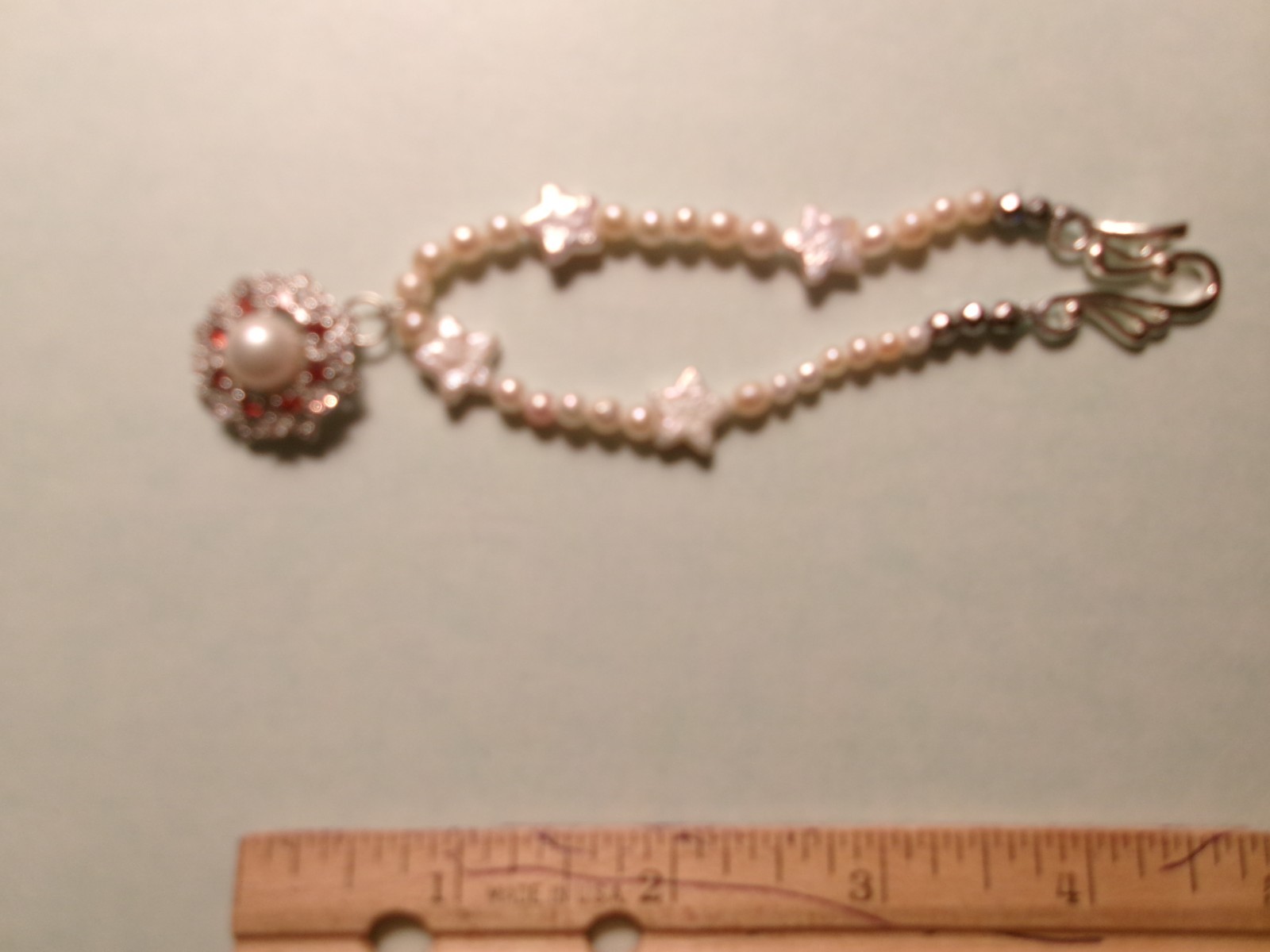 PEARL BRACELET WITH REAL PEARLS I MADE THIS ONE W HITE STARS PINKISH N WHIT