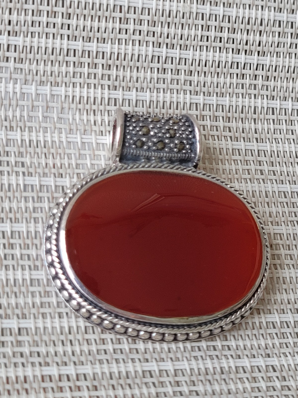 FINE CARNELIAN OVAL PENDANT, STERLING/ LARGE ROUND MARCASITE BALE
