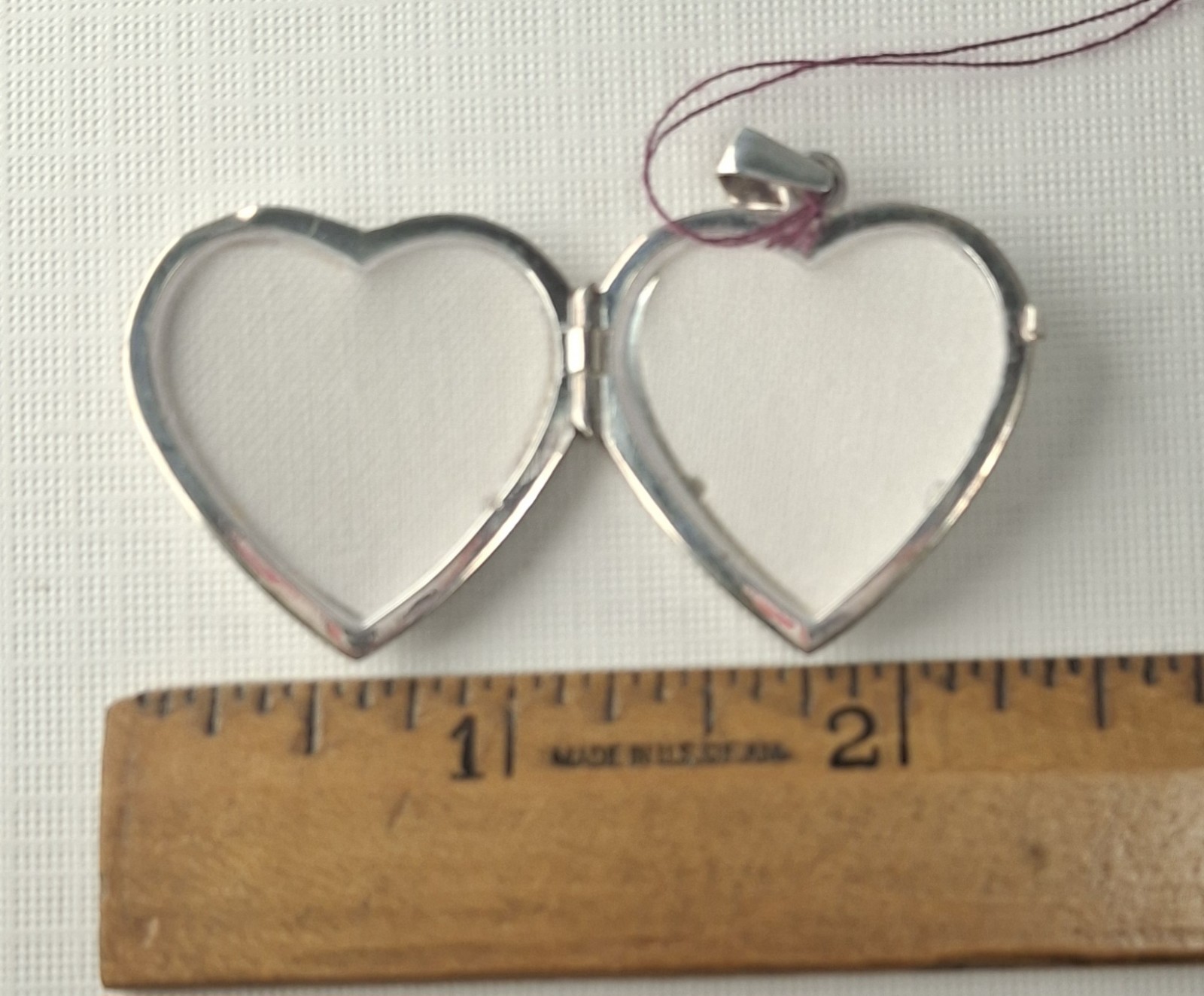 Sterling Silver Heart-Shaped Locket holds 2 photos 1 1/4″ x 1″ Made In Italy