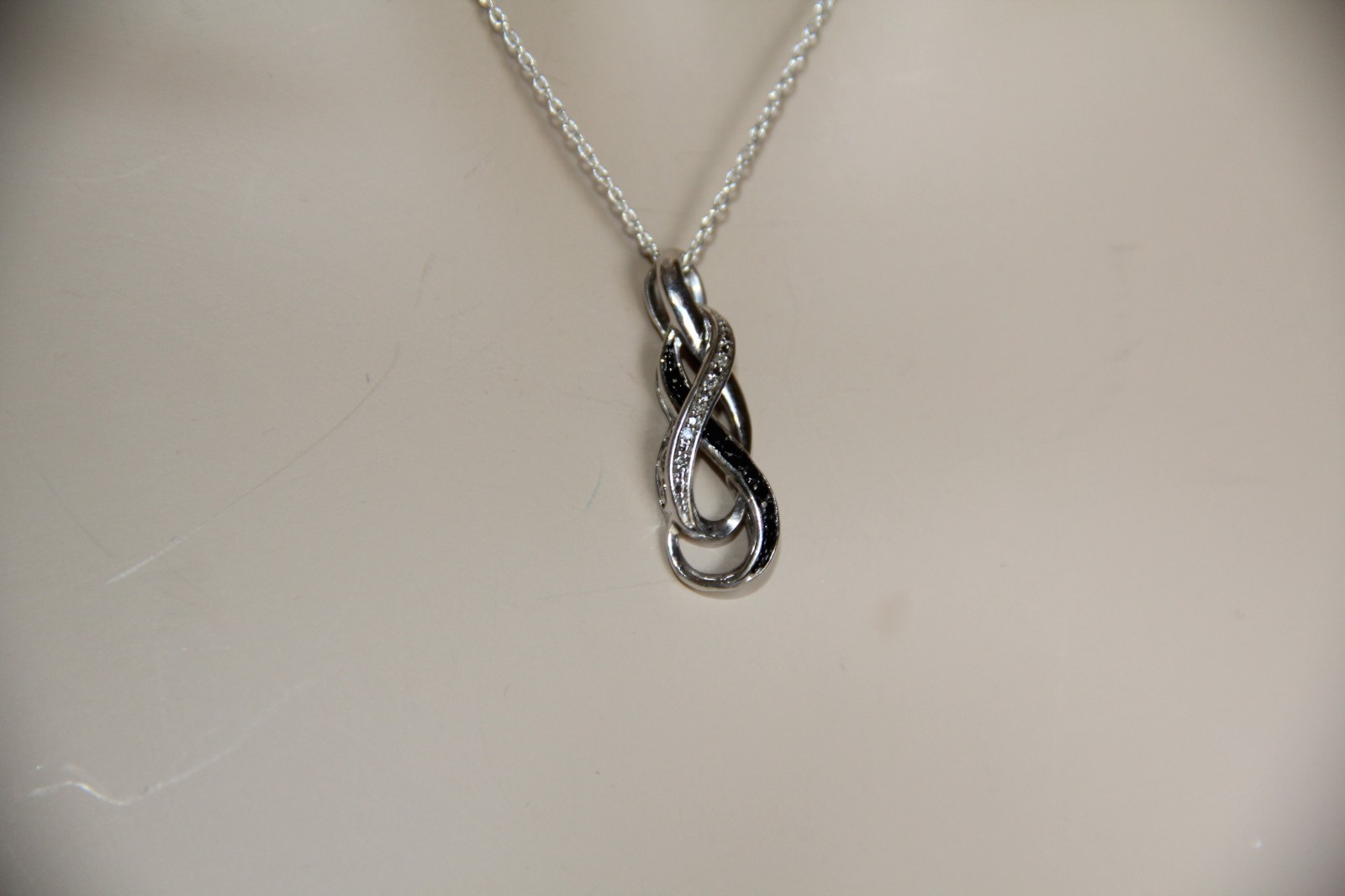 Sterling Silver Black and White Diamonds Infinity Pendant Necklace