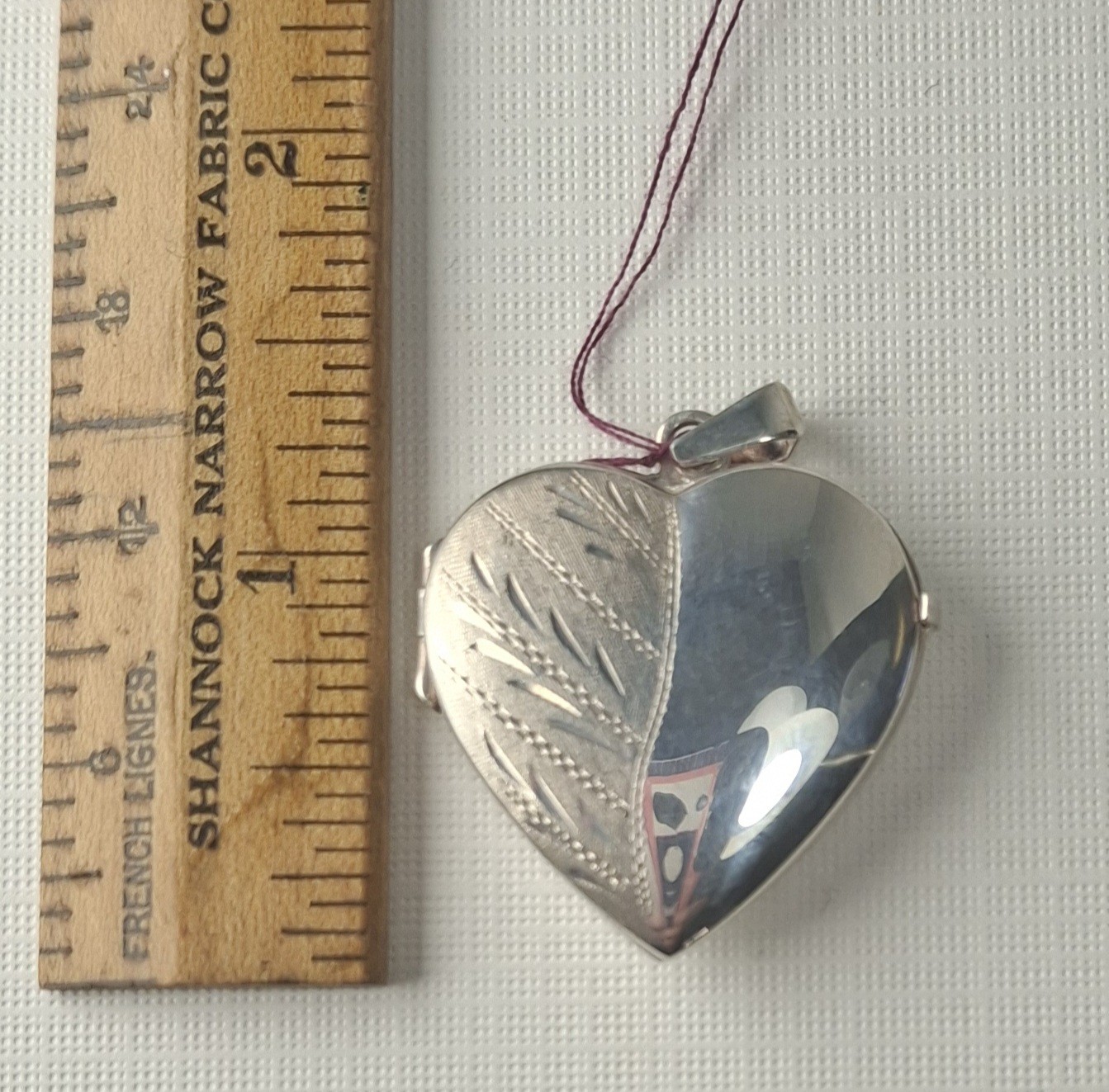 Sterling Silver Heart-Shaped Locket holds 2 photos 1 1/4″ x 1″ Made In Italy