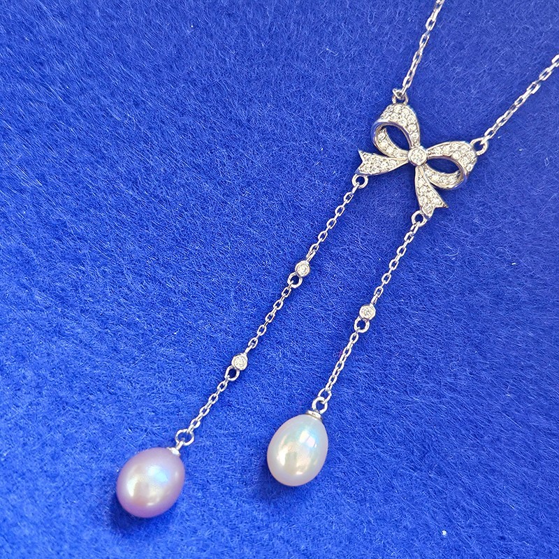 925 Sterling Silver Butterfly Knot with Fresh Water Pearl Tassels