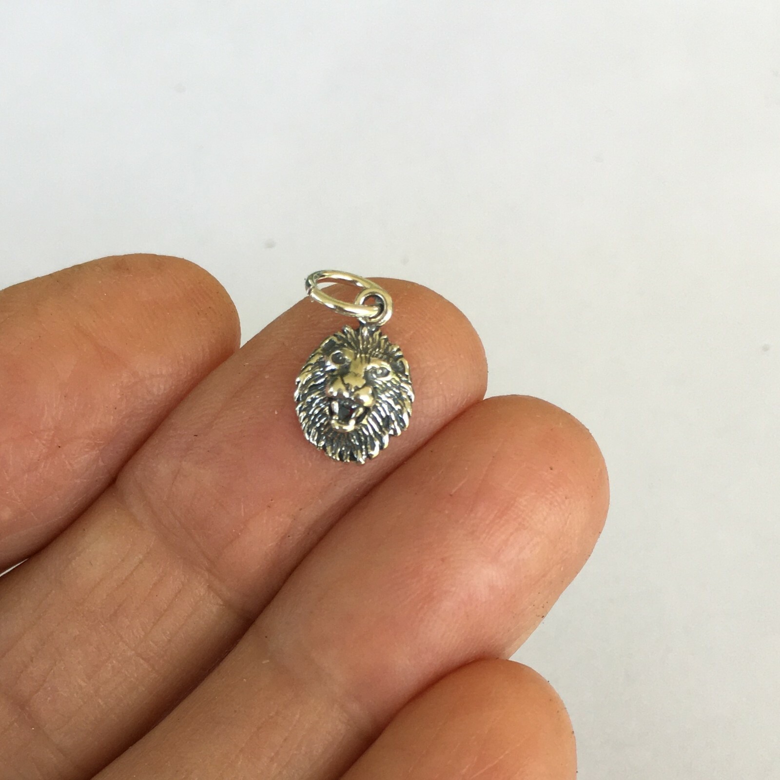 Very small Sterling Silver Lion face mini tiny charm.