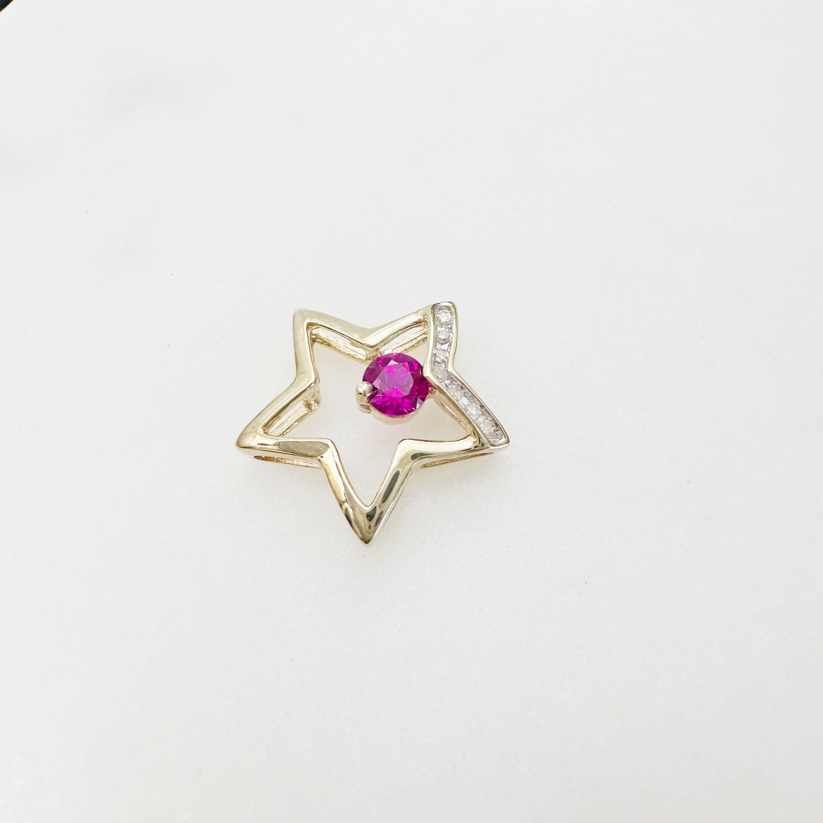 Solid 10K Yellow Gold .25ct Ruby & 7 Diamond Open Star Pendant 16mm, 1.2g