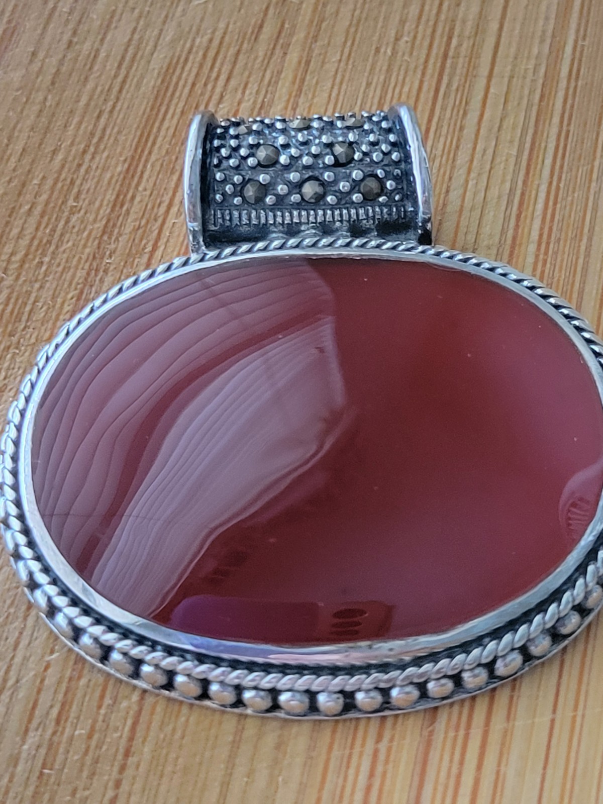 FINE CARNELIAN OVAL PENDANT, STERLING/ LARGE ROUND MARCASITE BALE