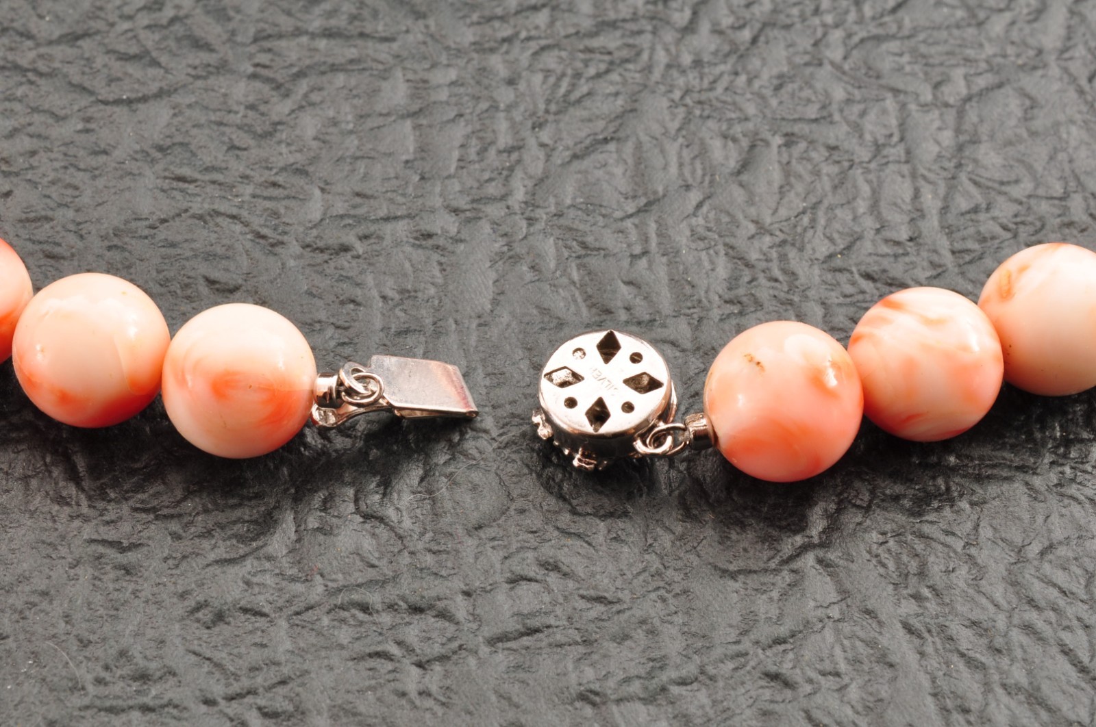 Angel skin coral necklace (17.3in, 423ct) ,925 silver clasp with “Certificate”.