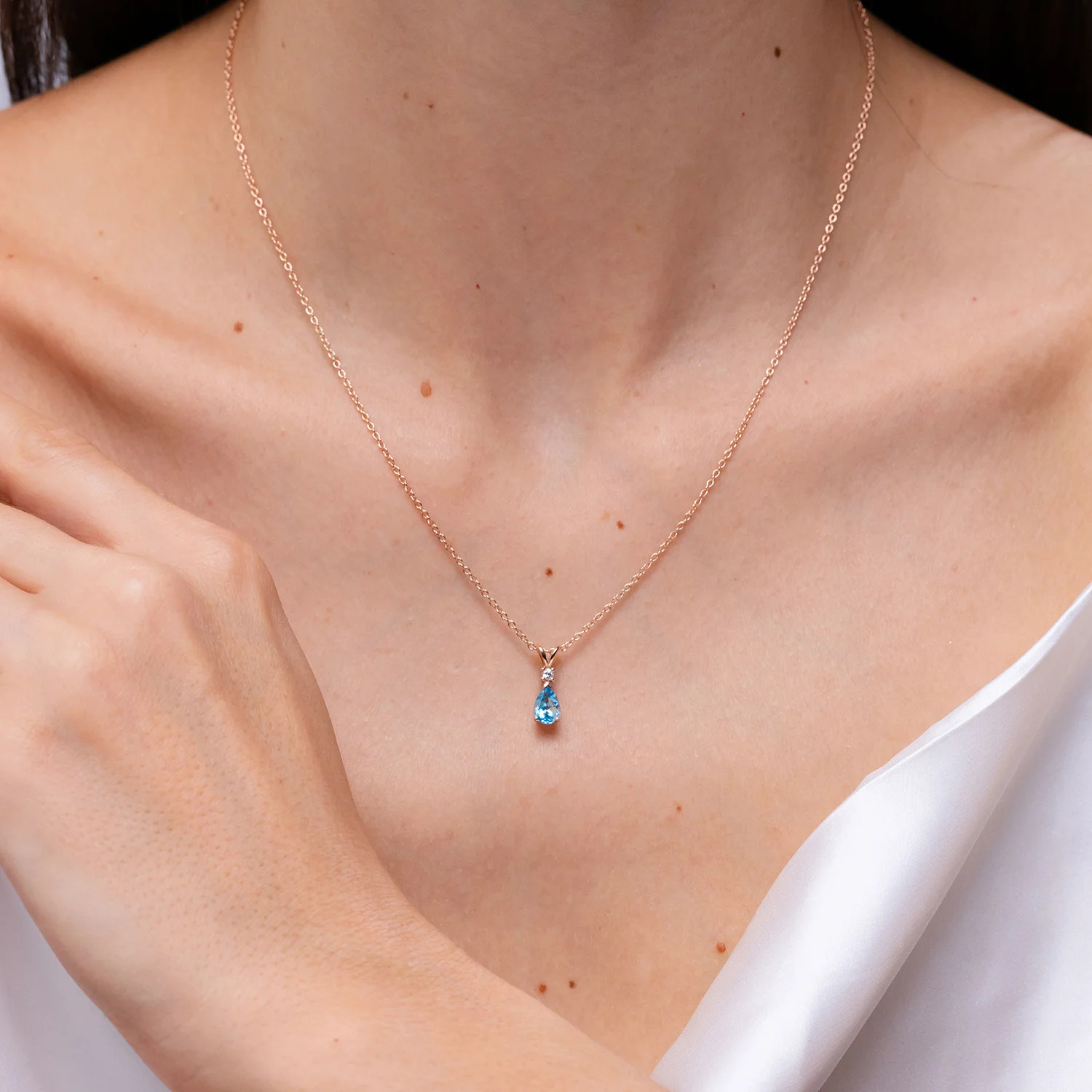 Angara Natural Swiss Blue Topaz Teardrop Pendant Necklace with Diamond in Silver