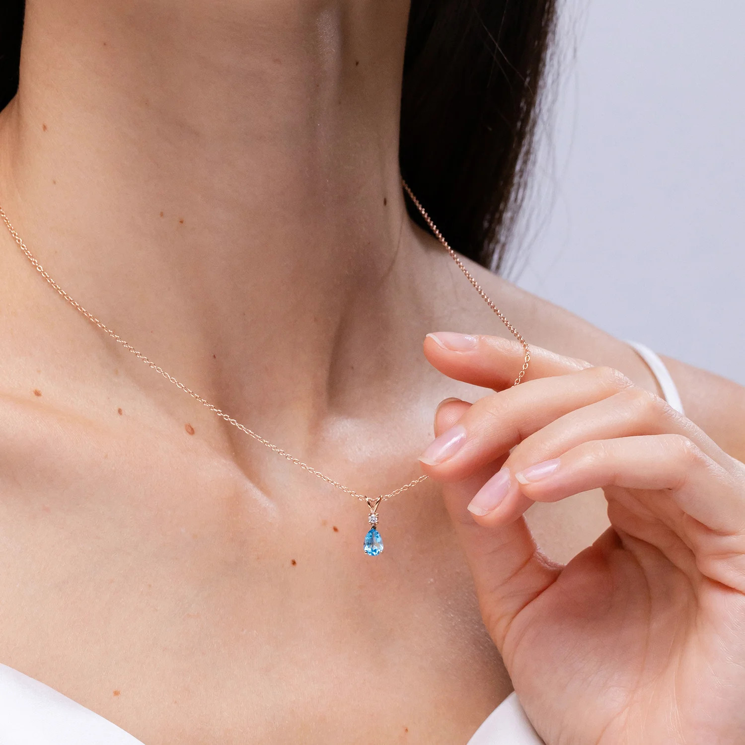 Angara Natural Swiss Blue Topaz Teardrop Pendant Necklace with Diamond in Silver