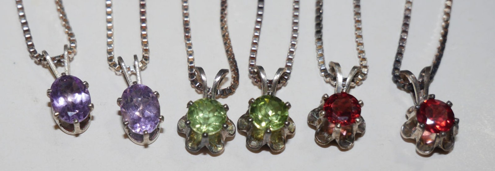 SIX gold tone 925 sterling silver necklace. 2 each garnets peridots blue topaz