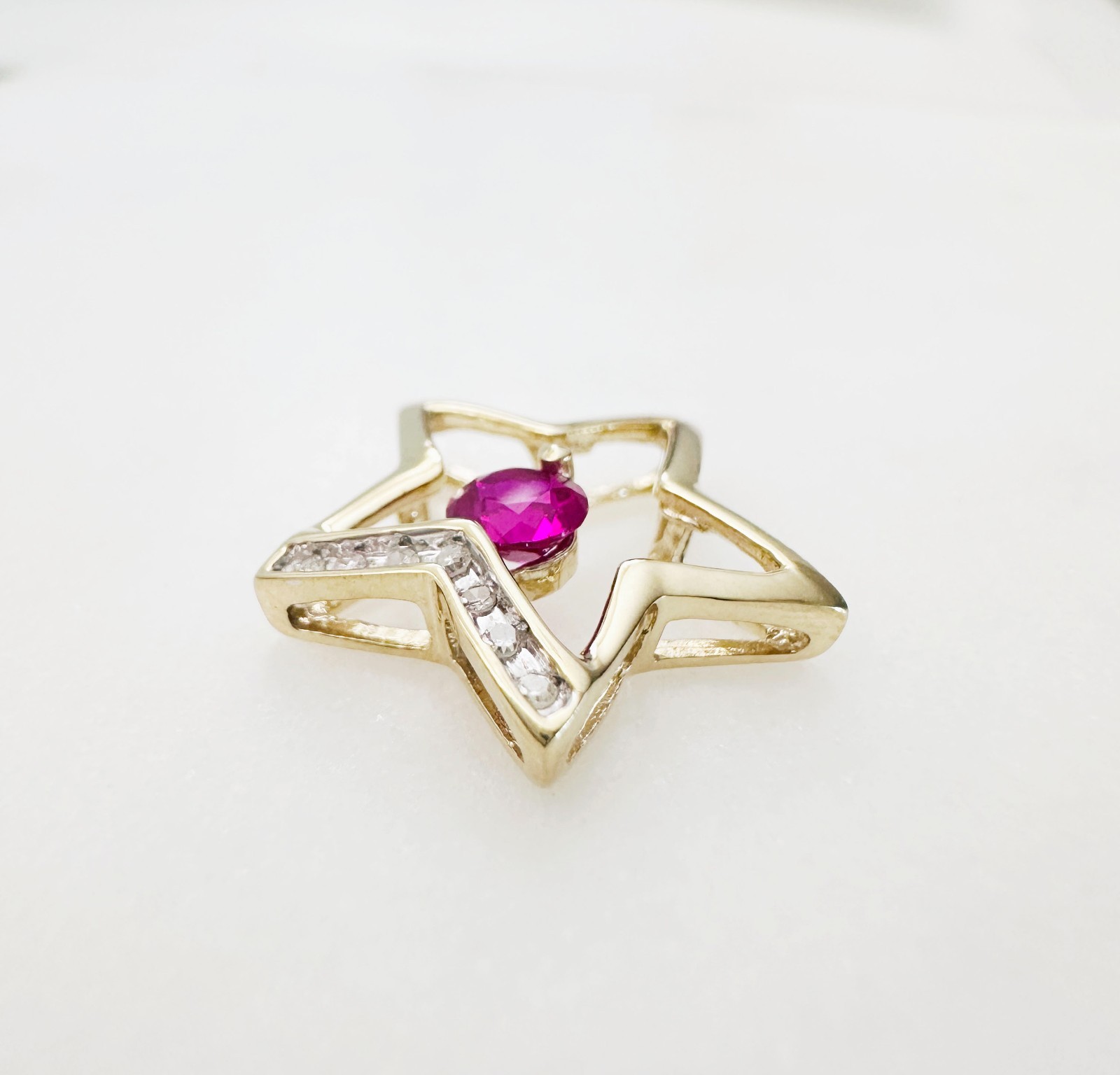 Solid 10K Yellow Gold .25ct Ruby & 7 Diamond Open Star Pendant 16mm, 1.2g