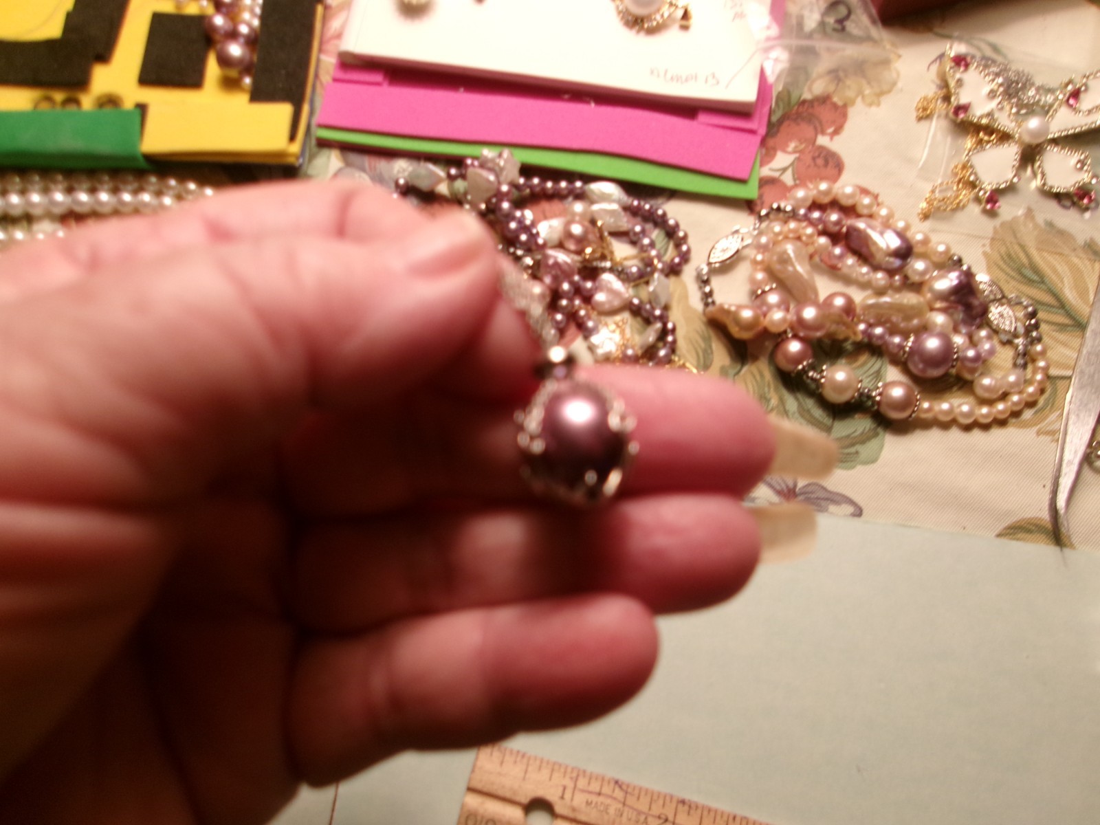 PEARL IN CAGE ABOUT 12.50 TO 13MM BETWEEN.COLOR FABULOUS I PAID 75.00 FOR THE P