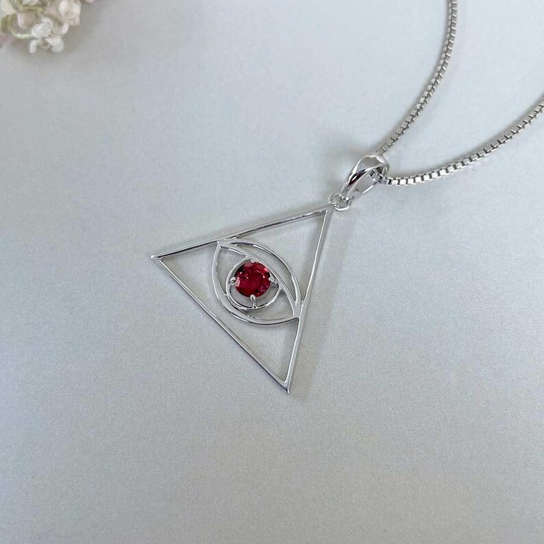 Lab Created Garnet Tringle Evil Eye Pendant for Women’s 14K White Gold Plated
