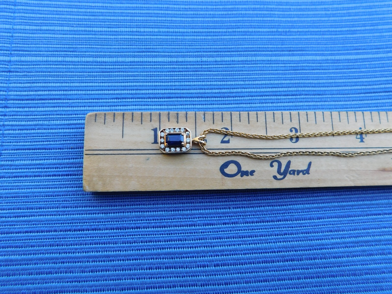 14k yellow gold sapphire and diamond pendant on 18″ 1 1/2 mm round chain