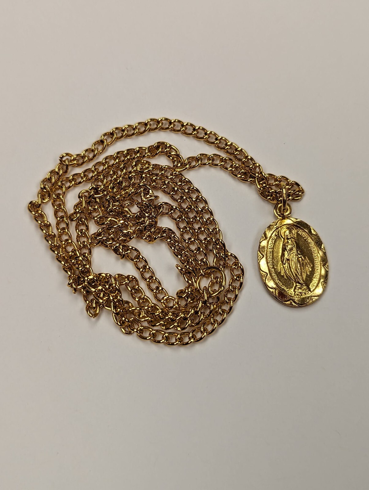 MIRACULOUS Medal Pendant, Oval 3/4″ x 1/2″ Gold Tone Aluminium on 20 inch chain