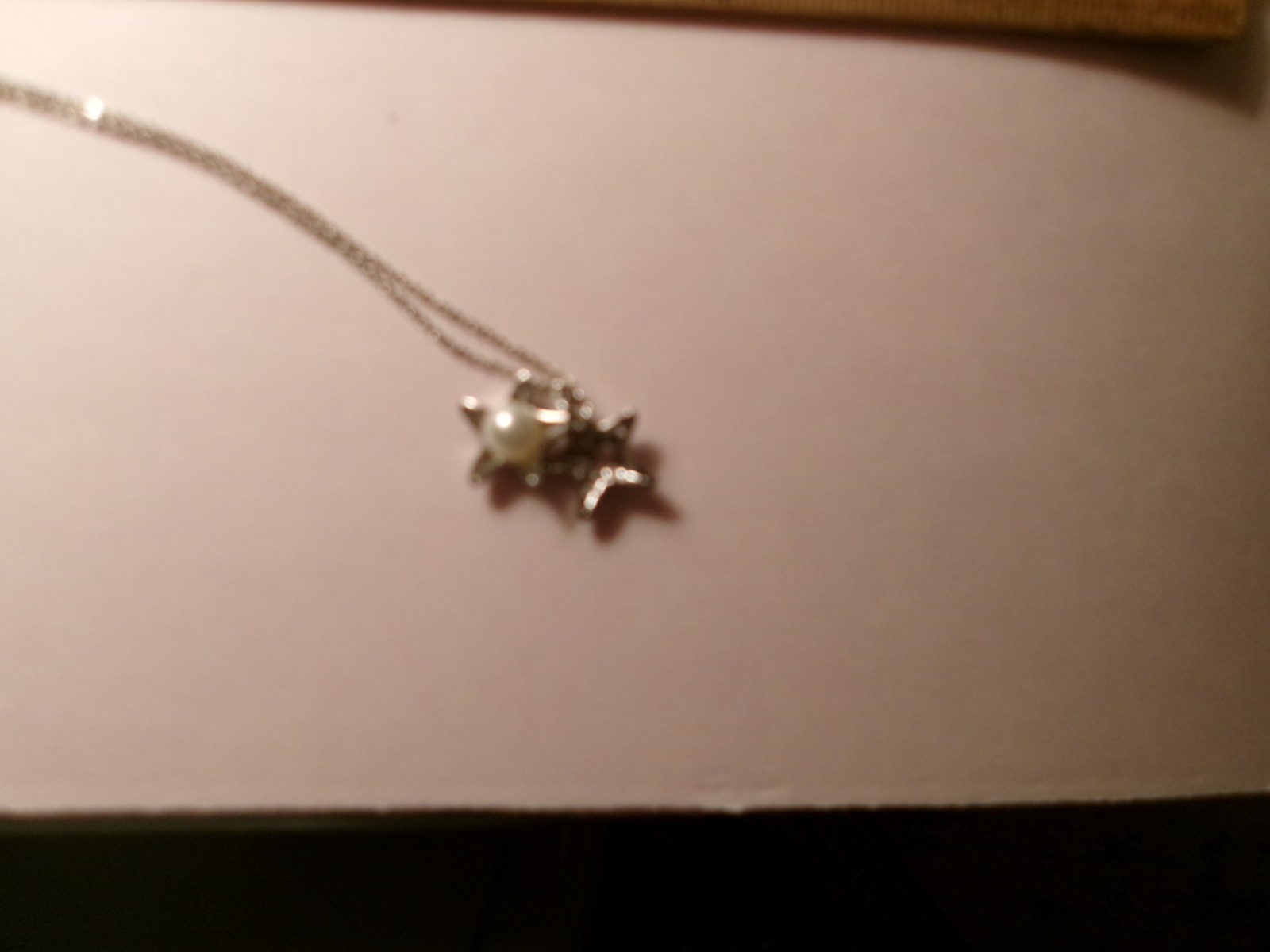 PEARL IN 2 STAR FISH NECKLACE
