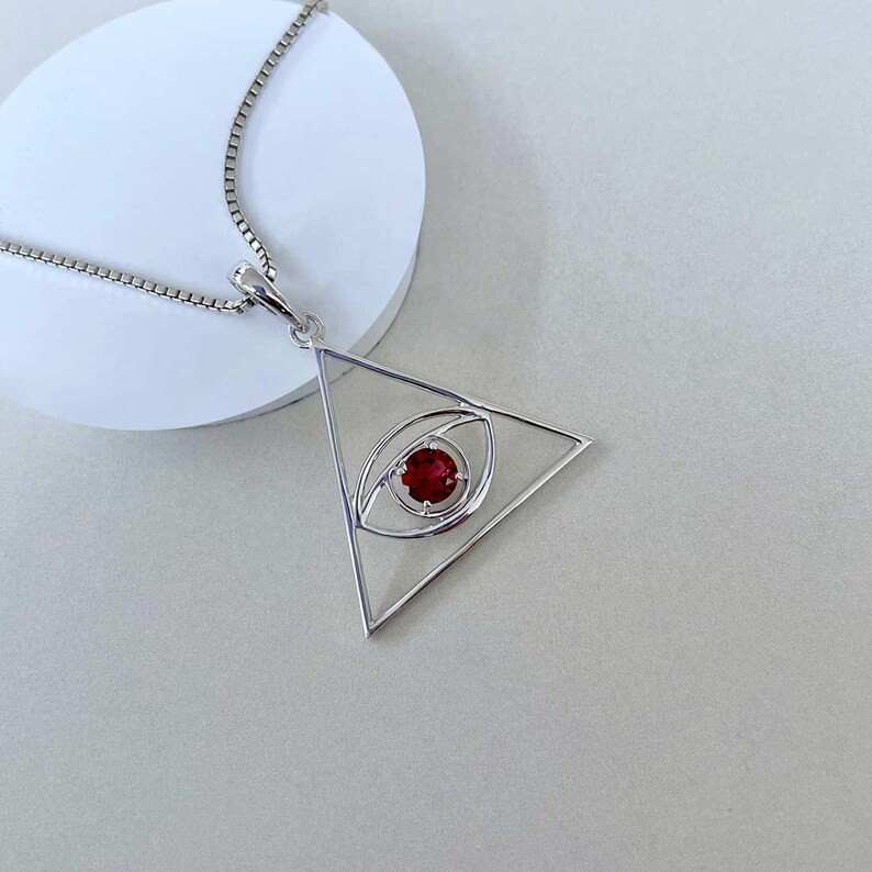 Lab Created Garnet Tringle Evil Eye Pendant for Women’s 14K White Gold Plated