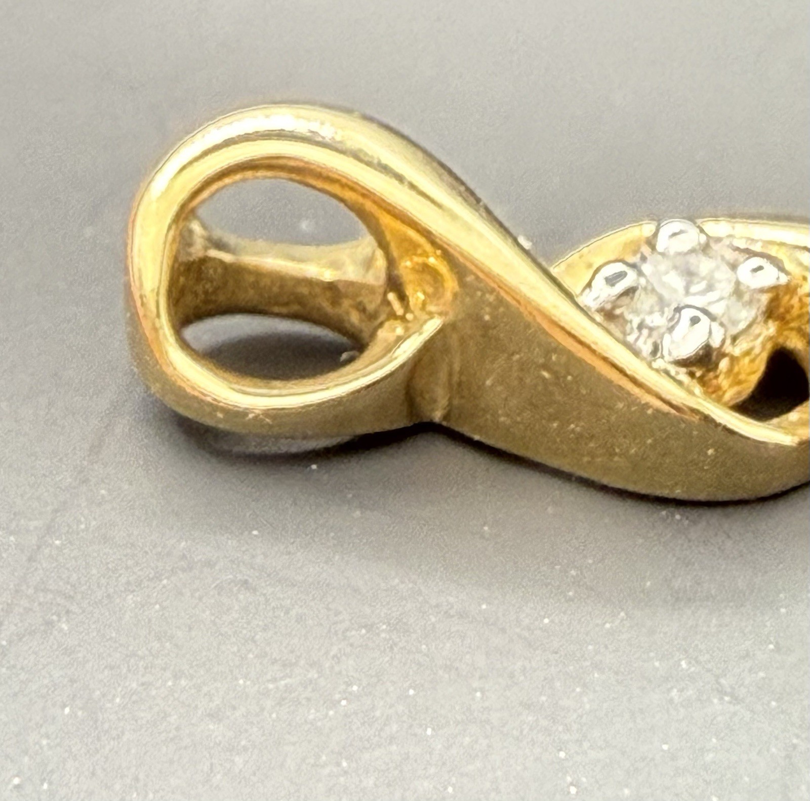 10K Yellow Gold Triple Infinity Pendant/charm featuring 3 genuine diamonds 1.4g