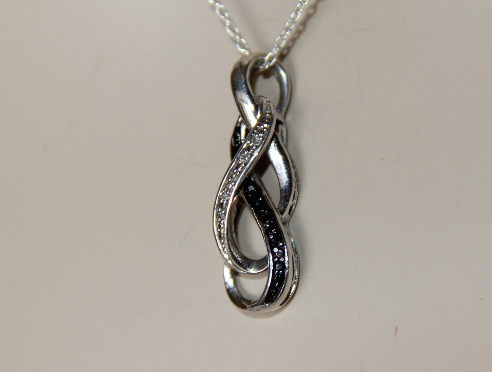 Sterling Silver Black and White Diamonds Infinity Pendant Necklace