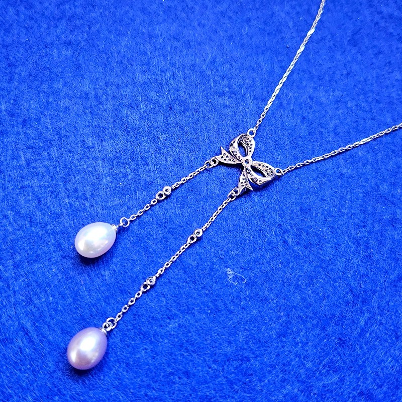 925 Sterling Silver Butterfly Knot with Fresh Water Pearl Tassels