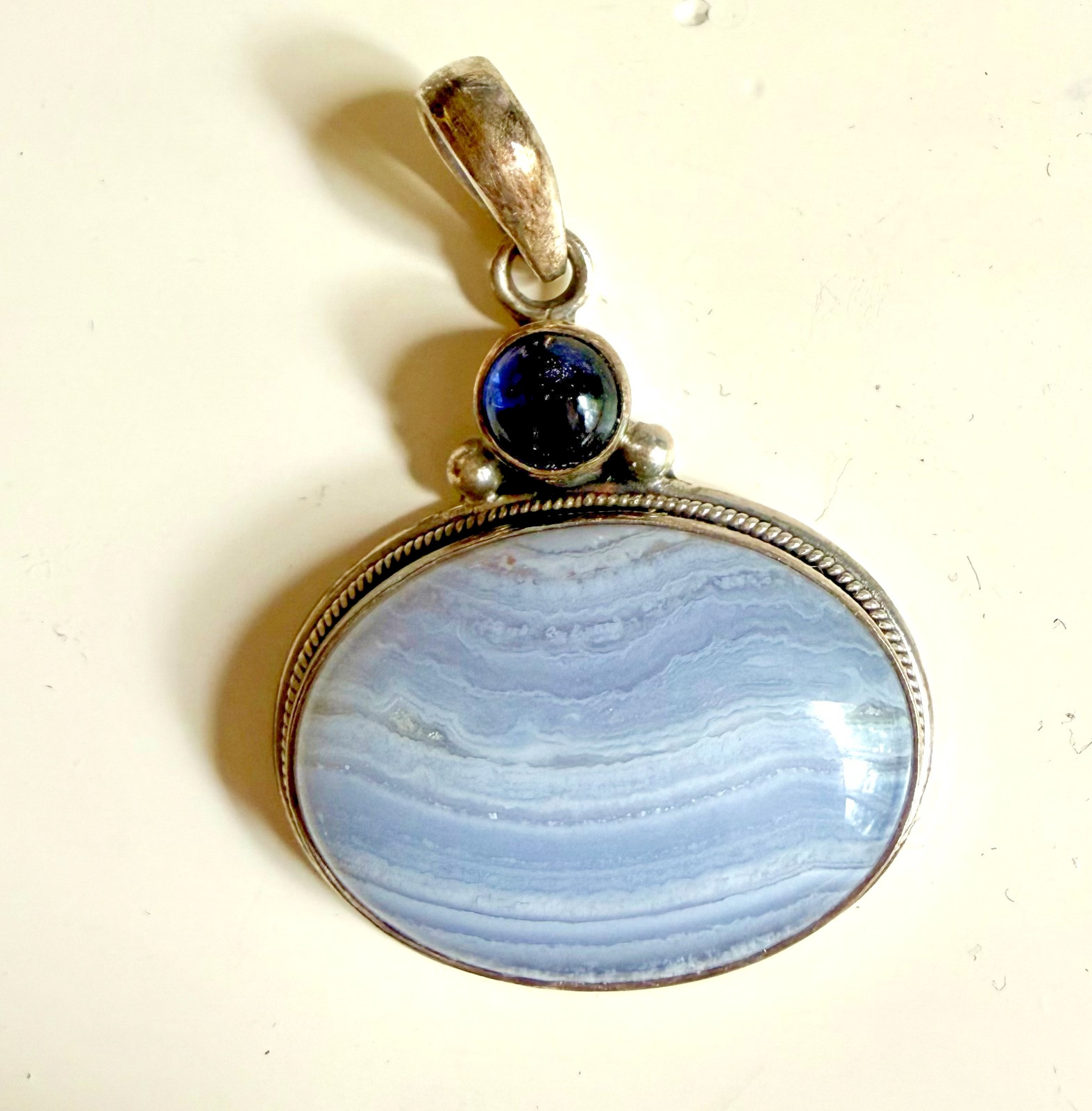 Sterling silver pendant featuring large blue oval blue lace agate