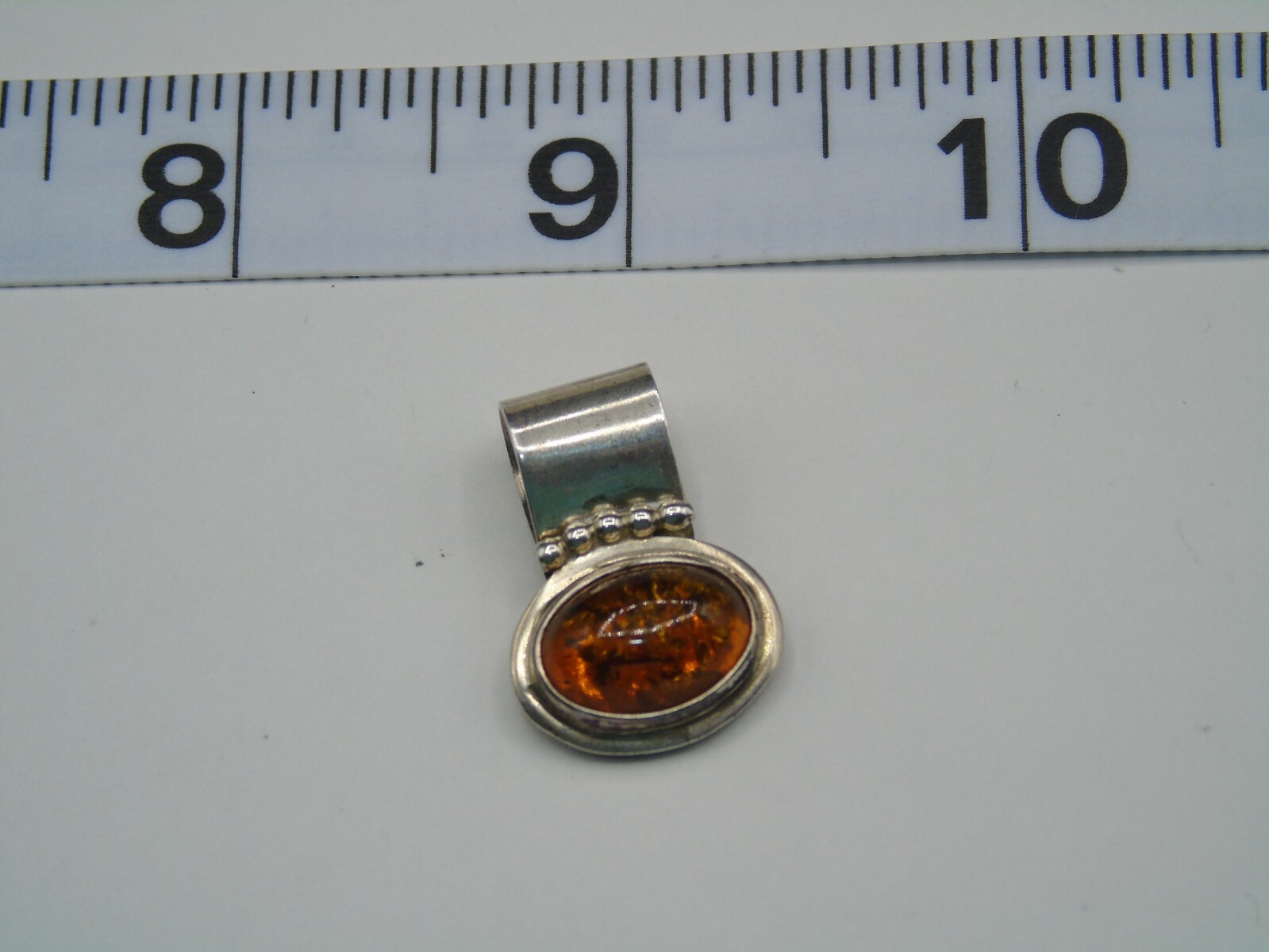 R. WILSON STERLING SILVER AND OPAL PENDANT IN PRE-OWNED VERY GOOD CONDITION