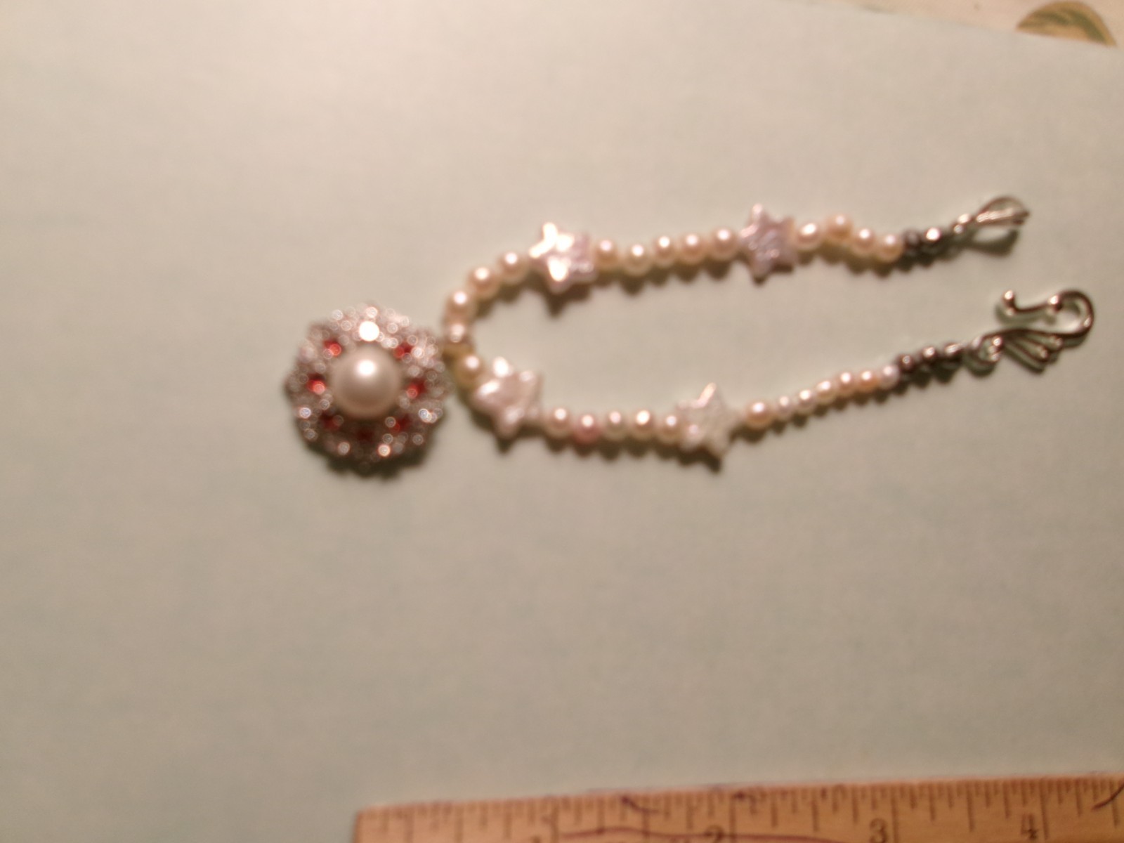 PEARL BRACELET WITH REAL PEARLS I MADE THIS ONE W HITE STARS PINKISH N WHIT