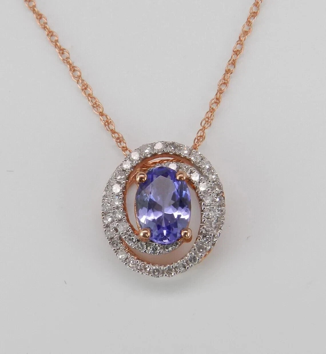 1.20Ct Oval Cut Lab-Created Blue Tanzanite Halo Pendant 14K Rose Gold Plated 18″