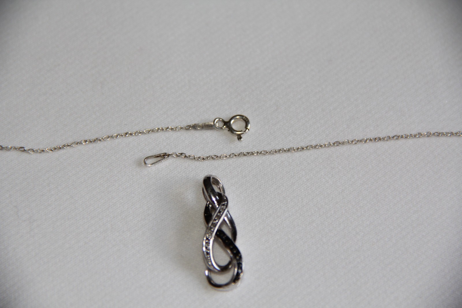 Sterling Silver Black and White Diamonds Infinity Pendant Necklace