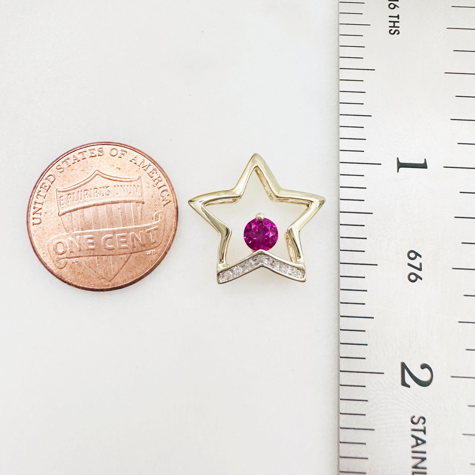 Solid 10K Yellow Gold .25ct Ruby & 7 Diamond Open Star Pendant 16mm, 1.2g