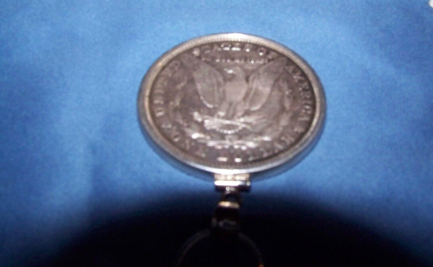 Morgan Silver Dollar in Sterling bezel on a 2mm 16–30-inch sterling necklace.