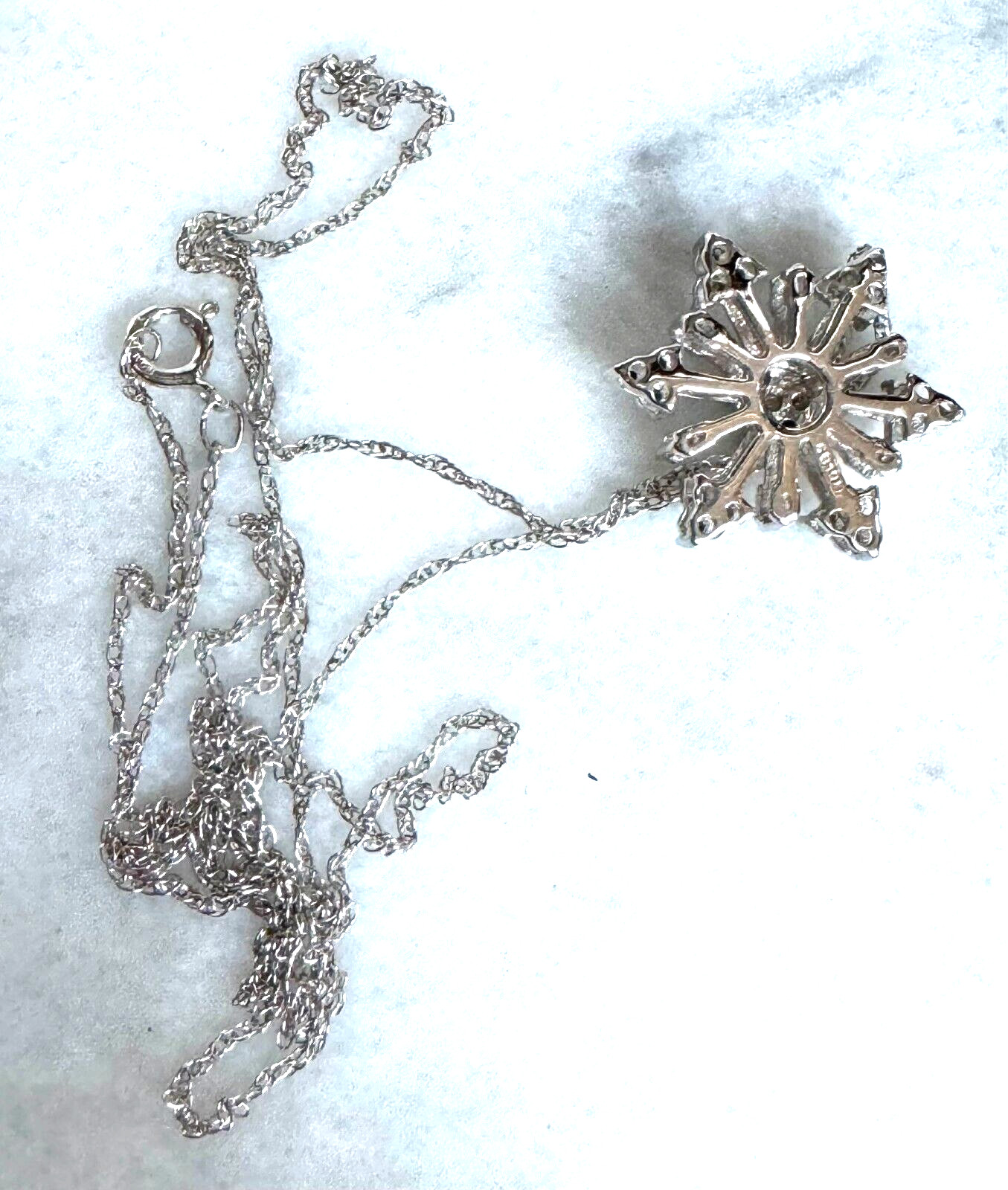 WHITE GOLD AND COLORLESS SAPPHIRE SNOWFLAKE PENDANT NECKLACE