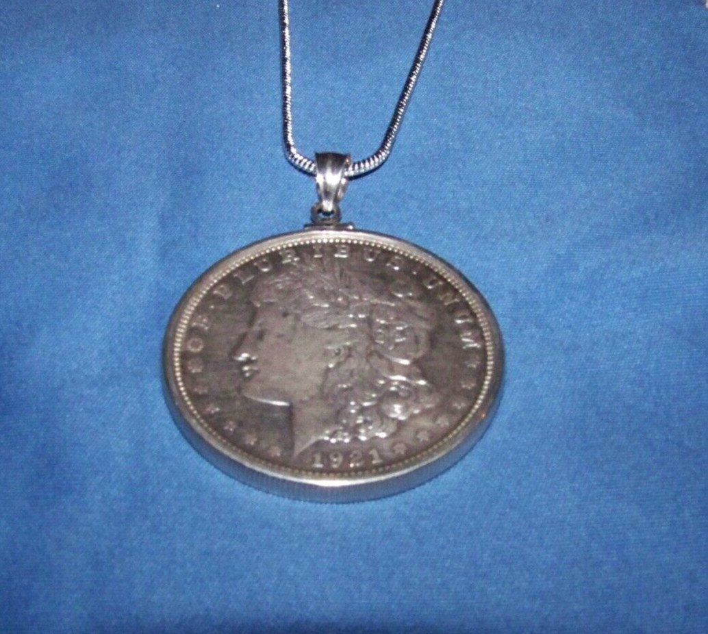 Morgan Silver Dollar in Sterling bezel on a 2mm 16–30-inch sterling necklace.