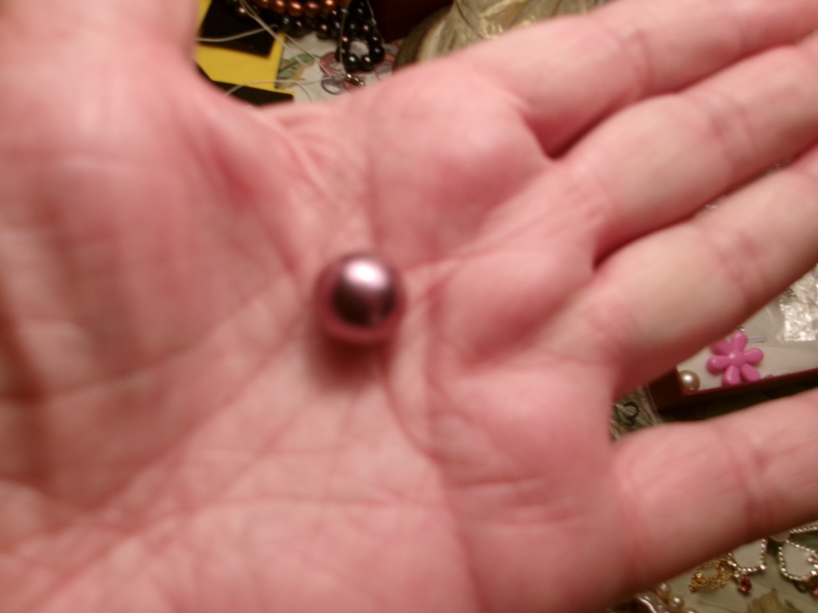 PEARL IN CAGE ABOUT 12.50 TO 13MM BETWEEN.COLOR FABULOUS I PAID 75.00 FOR THE P