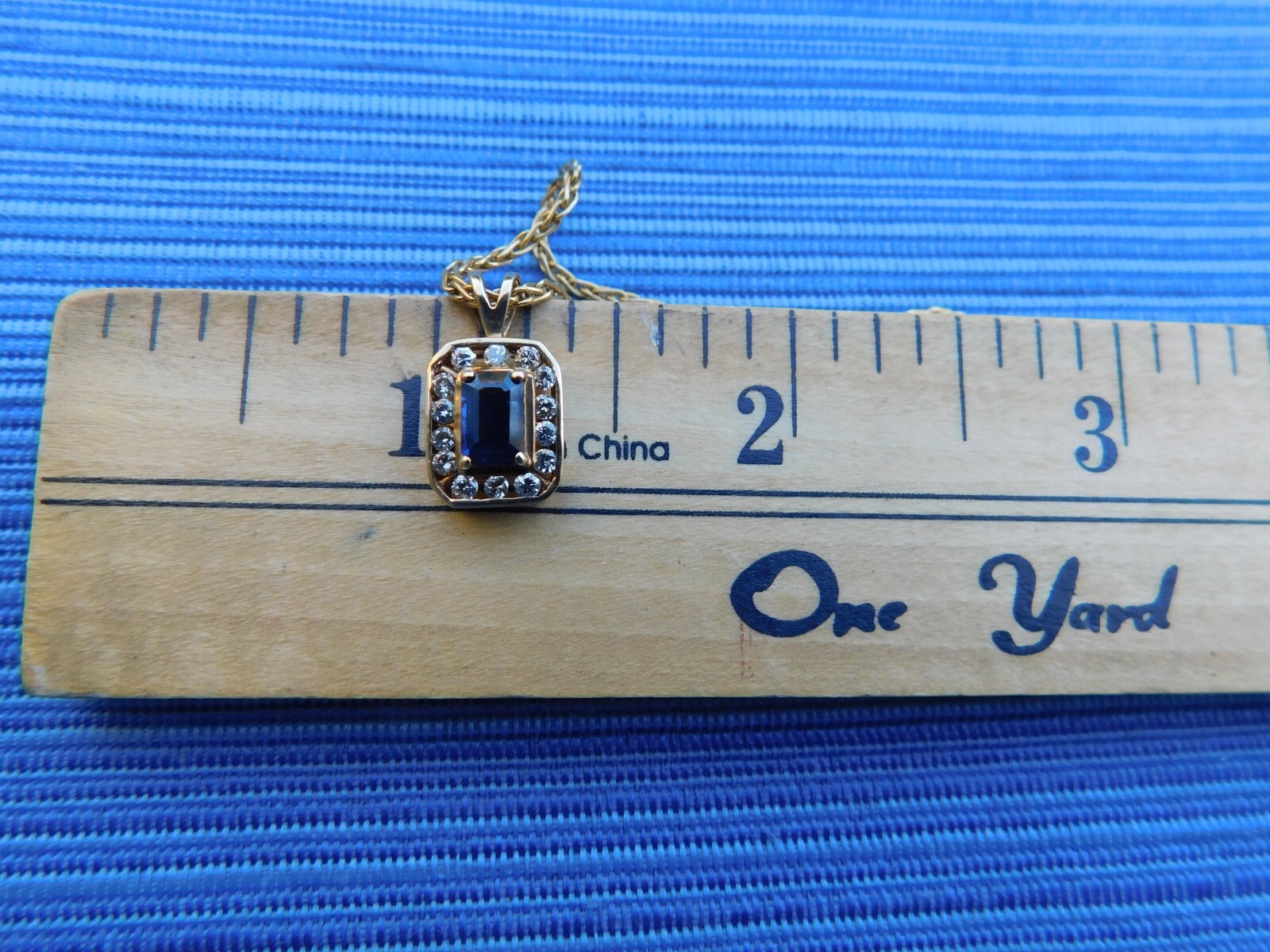 14k yellow gold sapphire and diamond pendant on 18″ 1 1/2 mm round chain