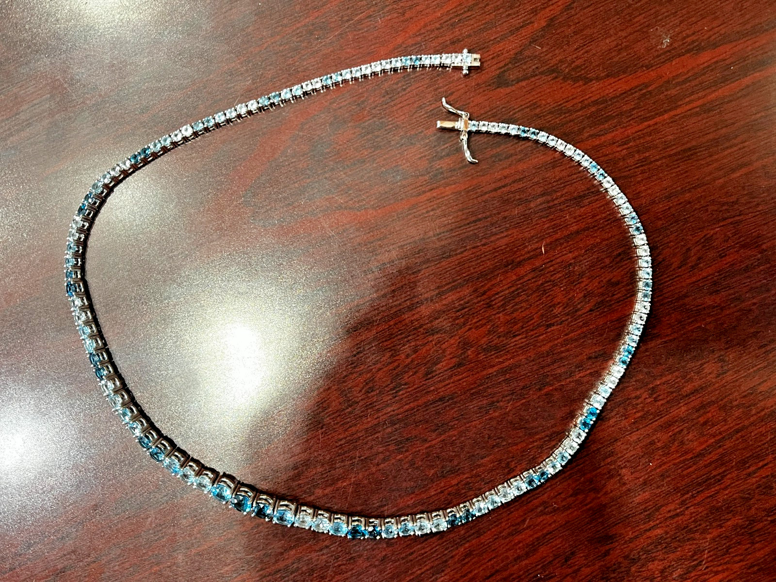 Sterling Silver Shades of Blue Topaz Graduated Tennis Necklace 18.25″