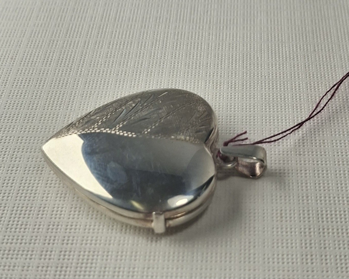 Sterling Silver Heart-Shaped Locket holds 2 photos 1 1/4″ x 1″ Made In Italy