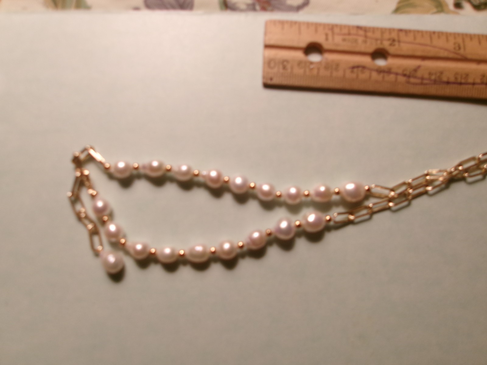 PEARL NICE SIZE REAL PEARLS…THE HEART HAS LIKE A WHITE SHELL INSIDE IT