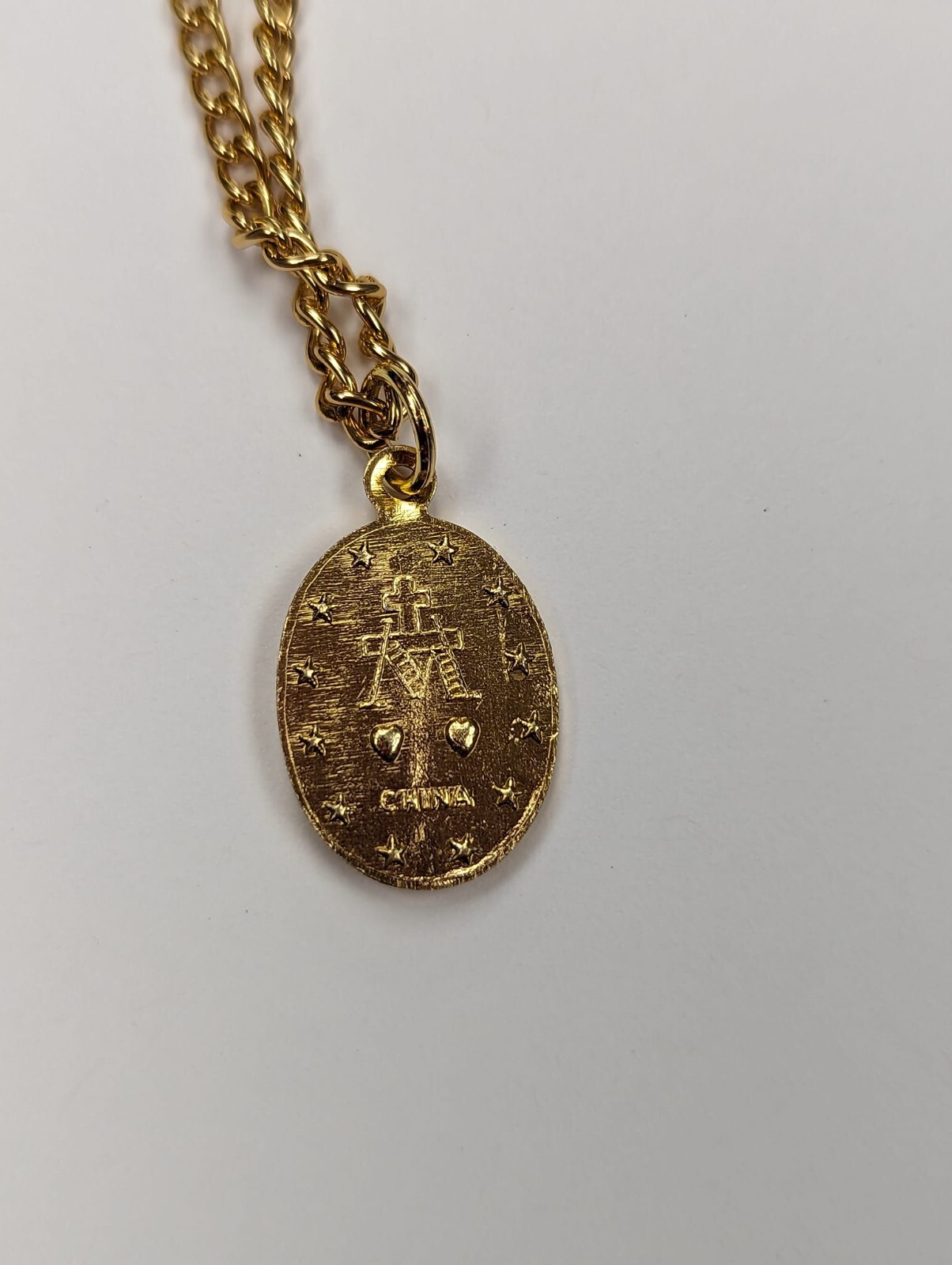 MIRACULOUS Medal Pendant, Oval 3/4″ x 1/2″ Gold Tone Aluminium on 20 inch chain