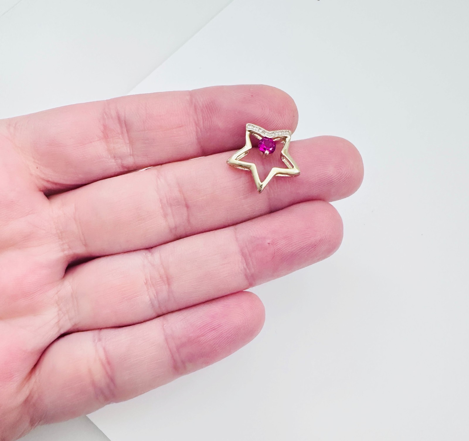 Solid 10K Yellow Gold .25ct Ruby & 7 Diamond Open Star Pendant 16mm, 1.2g