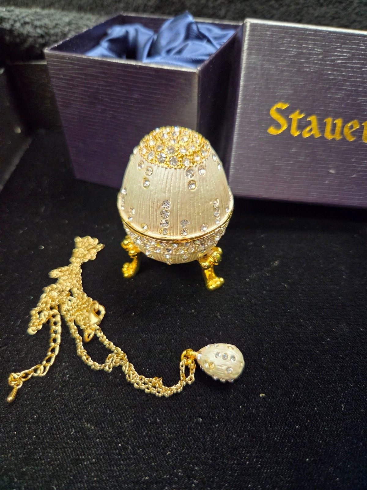 Stauer Egg Silver with Gold Gems in silk lines box with matching egg pendent