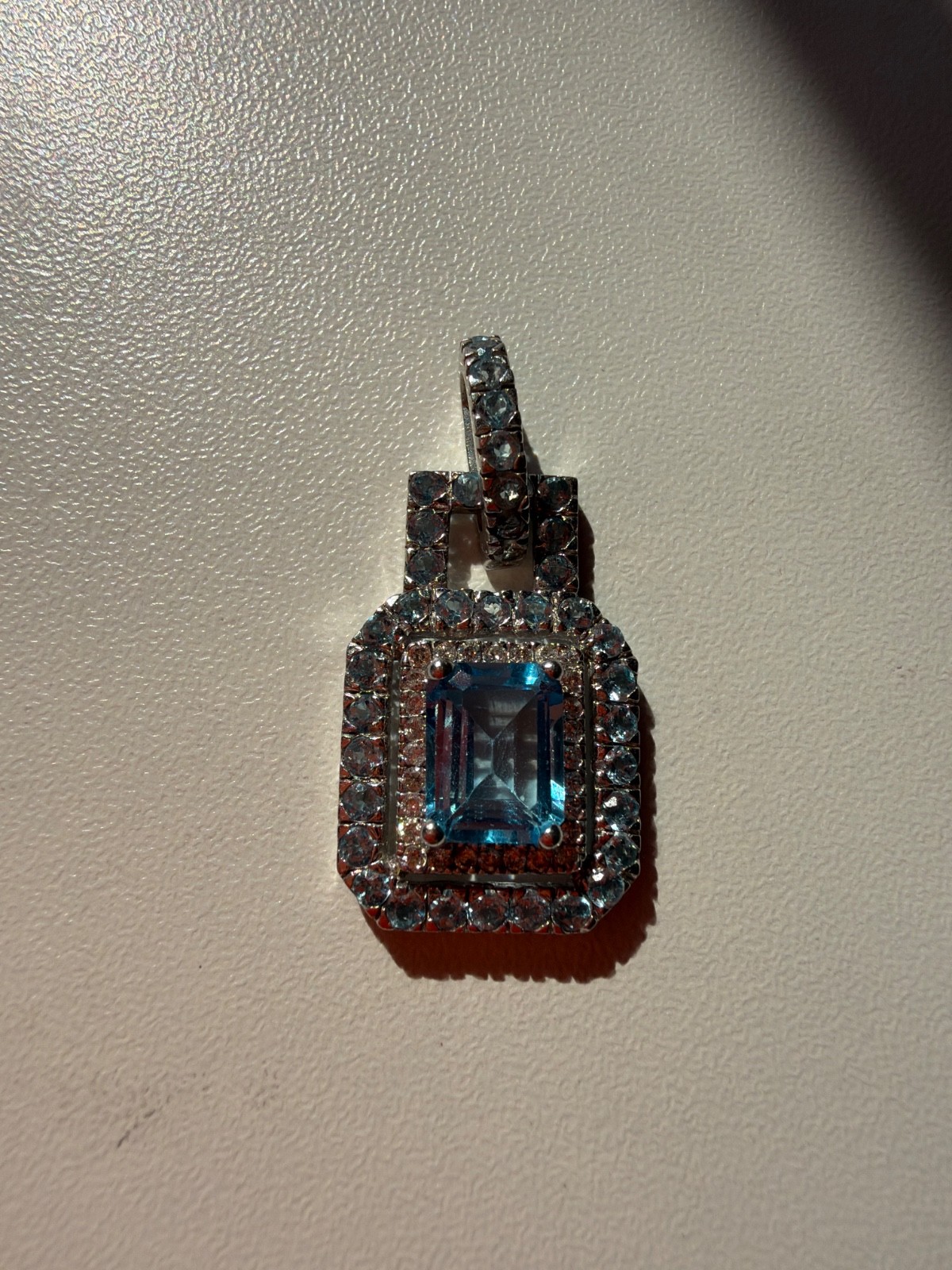 Beautiful 14K white gold blue topaz and diamond halo pendant in very good condit