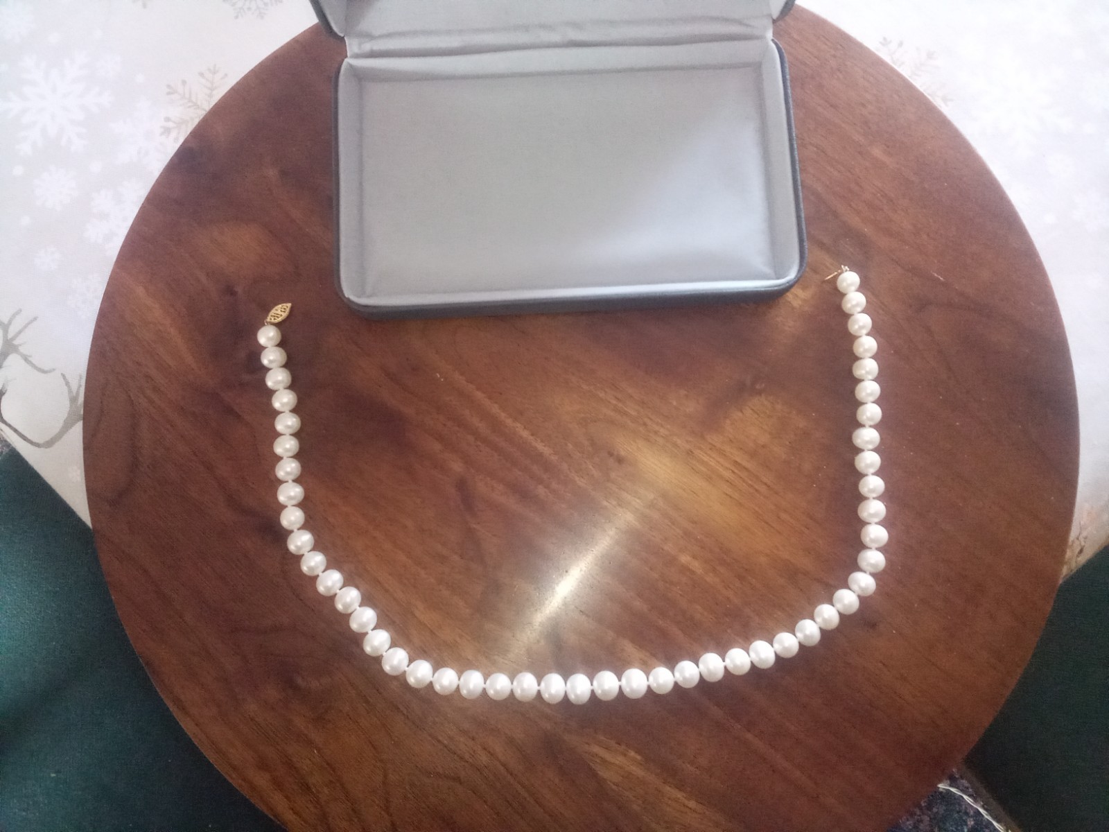 Cultured pearl necklace 18″ long with original box.
